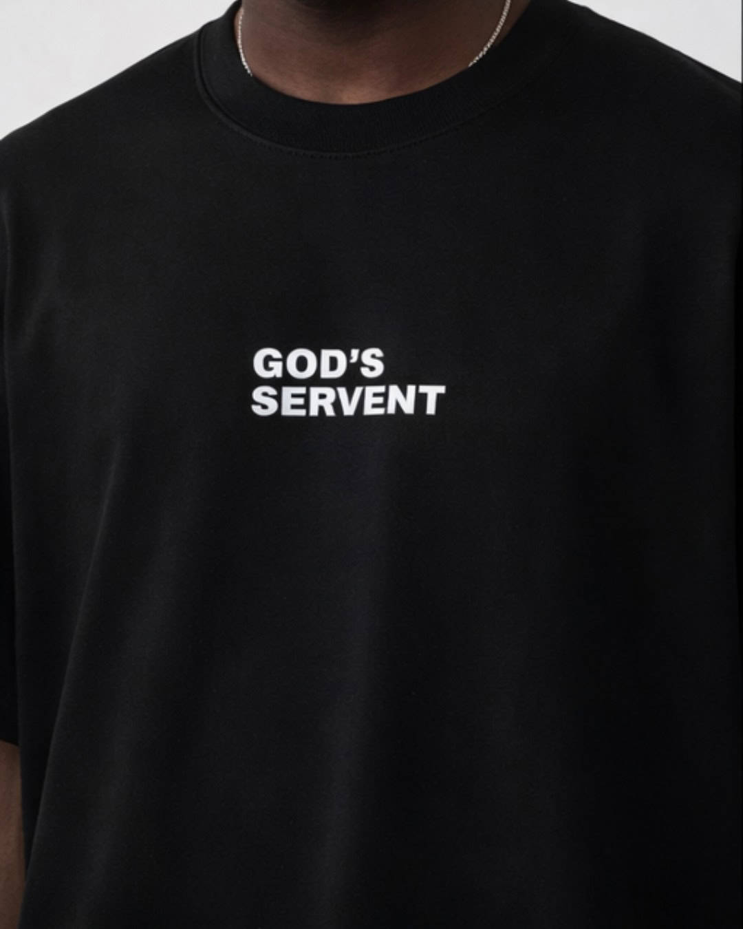 Simple black T-shirt with white "GOD'S SERVANT" text for .